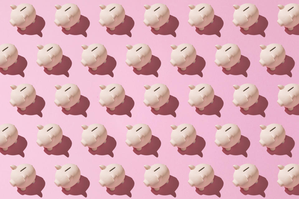 Little pink ceramic piggy bank pattern on pink background. Concept of saving money, savings.