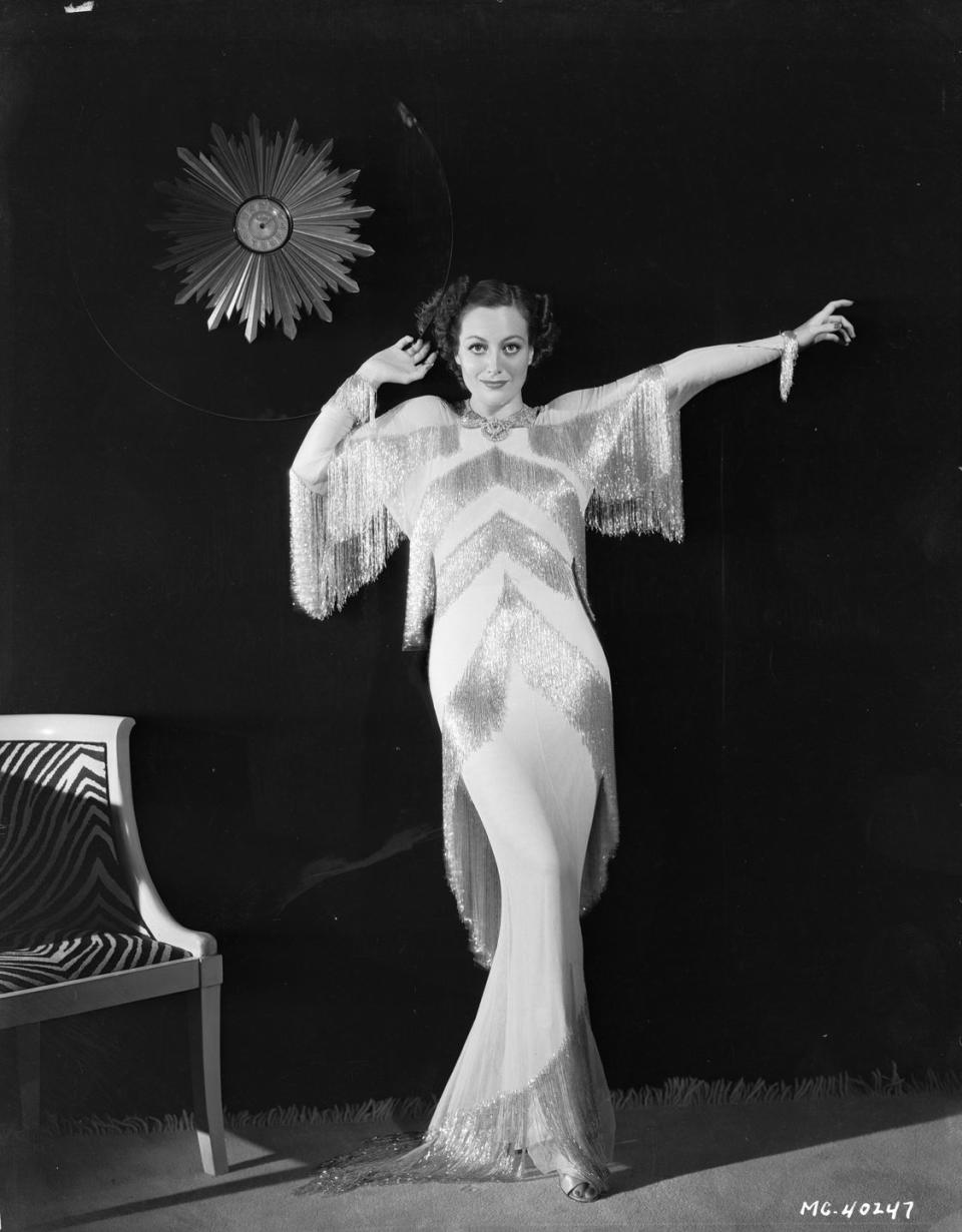 1932: Posing in a beaded evening gown