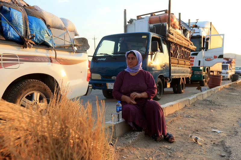 FILE PHOTO: Yazidi displaced family al-Hamo leave their home in Sharya town and head back to Sinjar