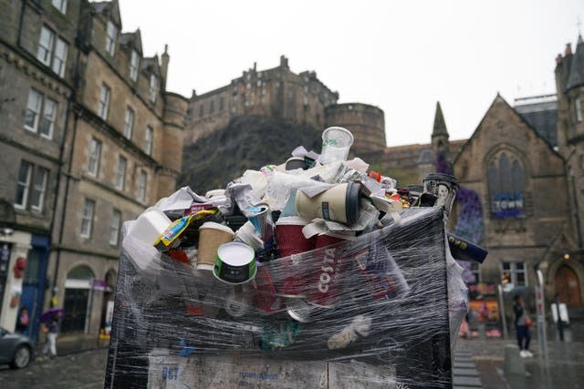 Overflowing bins with Edinburgh Castle in the background