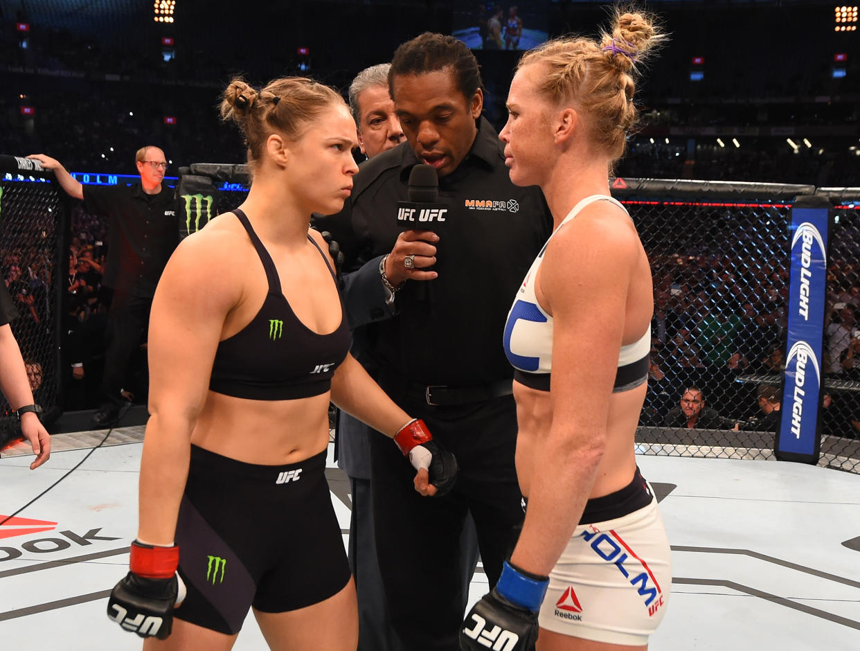 MELBOURNE, AUSTRALIA - NOVEMBER 15:  (L-R) Opponents UFC women's bantamweight champion Ronda Rousey of the United States and Holly Holm of the United States face off before their UFC women's bantamweight championship bout during the UFC 193 event at Etihad Stadium on November 15, 2015 in Melbourne, Australia. (Photo by Josh Hedges/Zuffa LLC/Zuffa LLC via Getty Images)