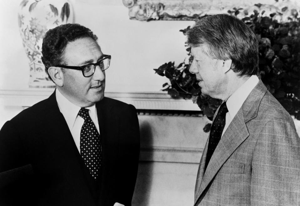 President Jimmy Carter (R) meets former Secretary of State Henry Kissinger to discuss Middle East peace proposals at the White House in Washington on August 15, 1977. (AFP via Getty Images)