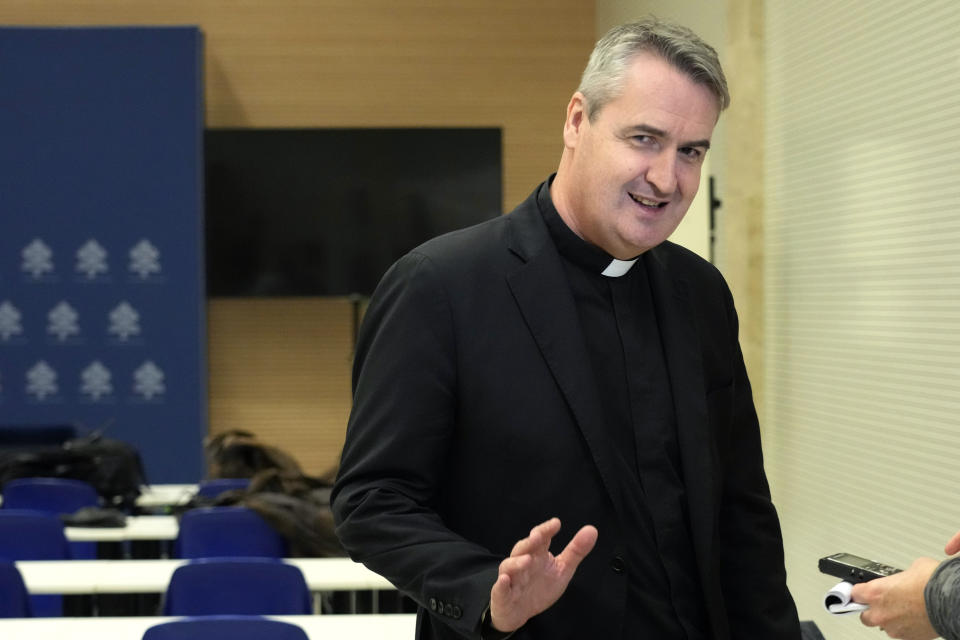 Rev. Andrew Small, secretary for the Pontifical Commission for the Protection of Minors, leaves after an interview with the Associated Press at the Vatican press room, Saturday, March 25, 2023. Pope Francis on Saturday updated a 2019 church law aimed at holding Catholic hierarchs accountable for covering up cases of sex abuse, expanding the norms to cover lay Catholic leaders and reaffirming that vulnerable adults can also be victims of abuse when they are unable to consent. (AP Photo/Alessandra Tarantino)