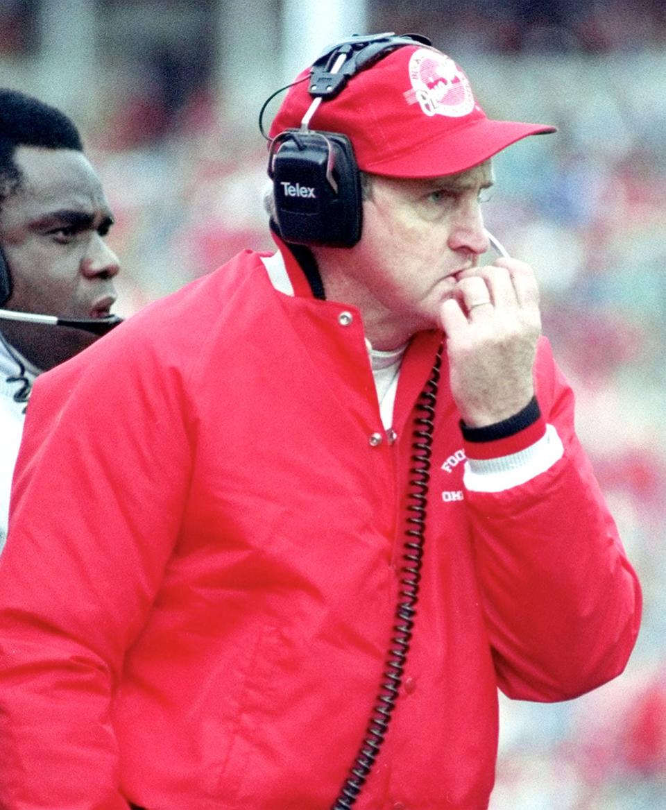 FILE -- OSU head football coach John Cooper bites his nails during a game on November 24, 1990 at Ohio Stadium in Columbus, Ohio.