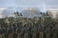 FILE - In this Jan. 4, 2021, file photo, Chinese soldiers rally while training in -20 degrees Celsius (-4 degrees Fahrenheit) conditions in Kashgar in northwestern China's Xinjiang Uighur Autonomous Region. An official from China's Communist Party signaled last December that there would likely be no letup in its crackdown in the remote Xinjiang region, but said the government's focus is shifting more to addressing the roots of extremism. This year's annual congress meeting comes as China and the U.S. are attempting to soften the caustic tone in relations that prevailed during the Trump administration. While President Joe Biden is maintaining pressure over trade and technology, he has shown a willingness to restore dialogue. However, China has not shown any willingness to budge in the face of U.S. support for Taiwan and criticism of Beijing's policies in Hong Kong, Tibet and Xinjiang. (Chinatopix Via AP, File)