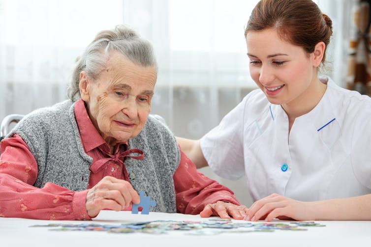 <span class="caption">Those who had higher negative thinking patterns had greater cognitive decline.</span> <span class="attribution"><a class="link " href="https://www.shutterstock.com/image-photo/nurse-helps-senior-woman-jigsaw-puzzle-177566192" rel="nofollow noopener" target="_blank" data-ylk="slk:Alexander Raths/ Shutterstock;elm:context_link;itc:0;sec:content-canvas">Alexander Raths/ Shutterstock</a></span>