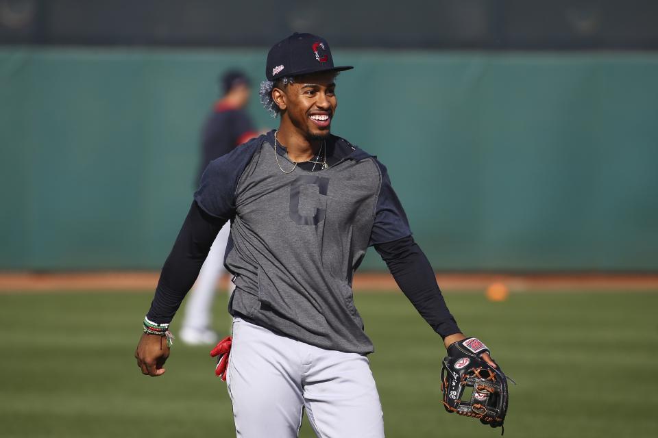Cleveland Indians shortstop Francisco Lindor smiles as he works on infield drills during spring training baseball workouts Friday, Feb. 21, 2020, in Goodyear, Ariz. (AP Photo/Ross D. Franklin)