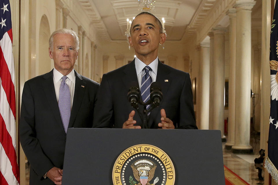 Former President Barack Obama, standing with then-Vice President Joe Biden, delivers remarks in the East Room of the White House in Washington, Tuesday, July 14, 2015, after an Iran nuclear deal is reached.