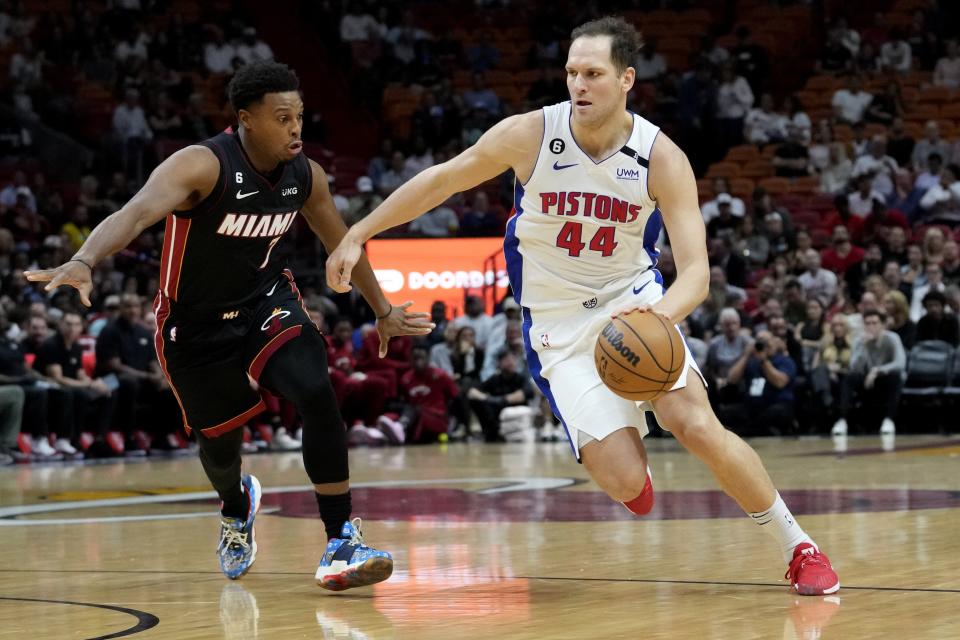 Miami Heat guard Kyle Lowry (7) defends against Detroit Pistons forward Bojan Bogdanovic (44) during the first half of an NBA basketball game Tuesday, Dec. 6, 2022, in Miami.