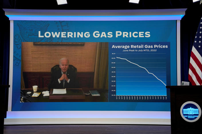 President Biden is seen onscreen during a virtual meeting with his economic team.