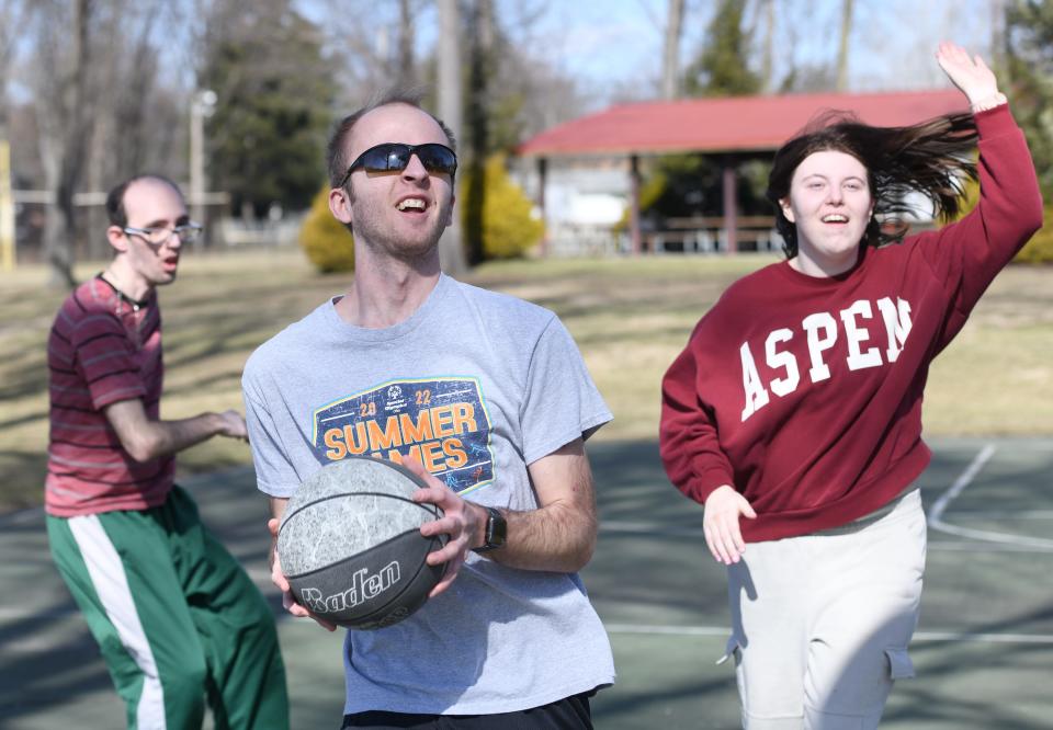 Kameron Long goes up for a shot during a friendly game of basketball at Price Park in North Canton. Long is a client with KBY Services in Canton.