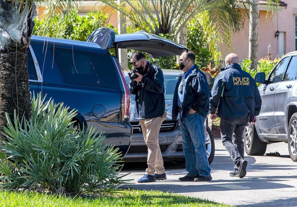 Authorities take pictures of former state Senator Frank Artiles car as they raid his home in Palmetto Bay on Wednesday, March 17, 2021.