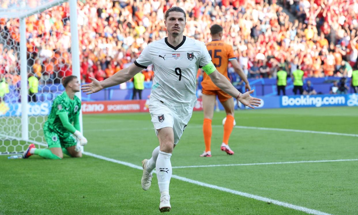 <span>Austria's Marcel Sabitzer celebrates his winner.</span><span>Photograph: Ronny Hartmann/AFP/Getty Images</span>