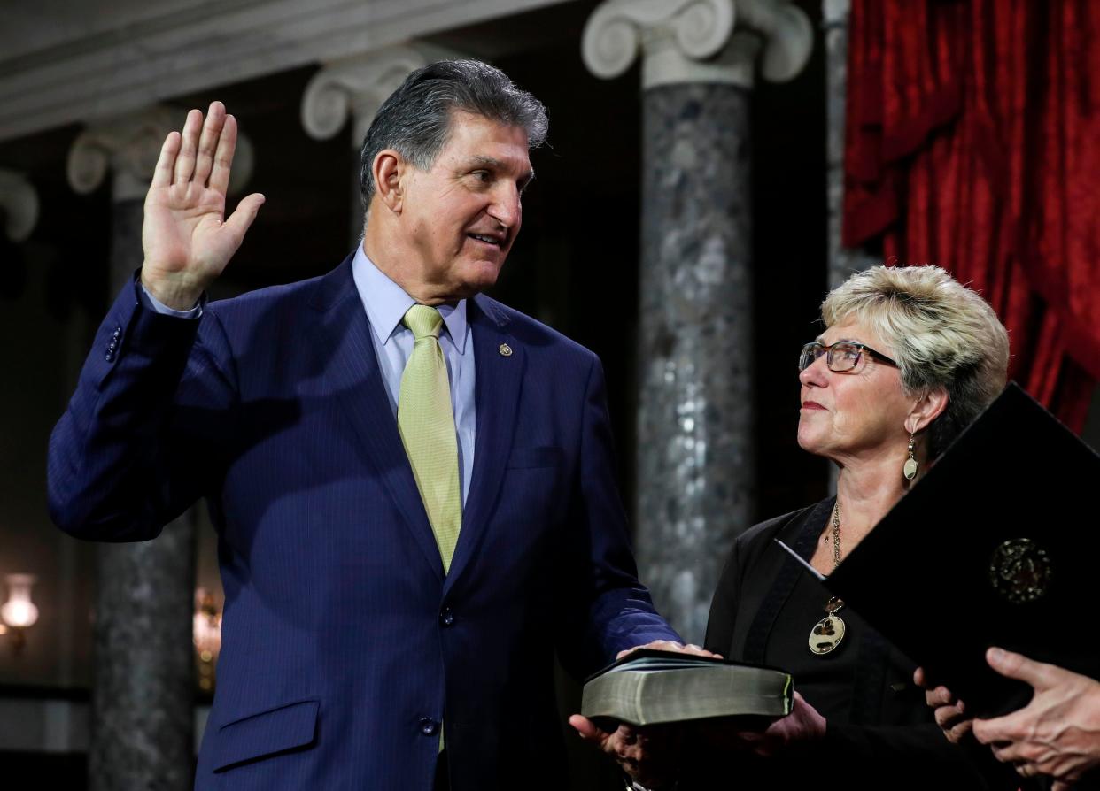 <p>Gayle Manchin, right, has been banned from entering any part of China</p> (AFP via Getty Images)