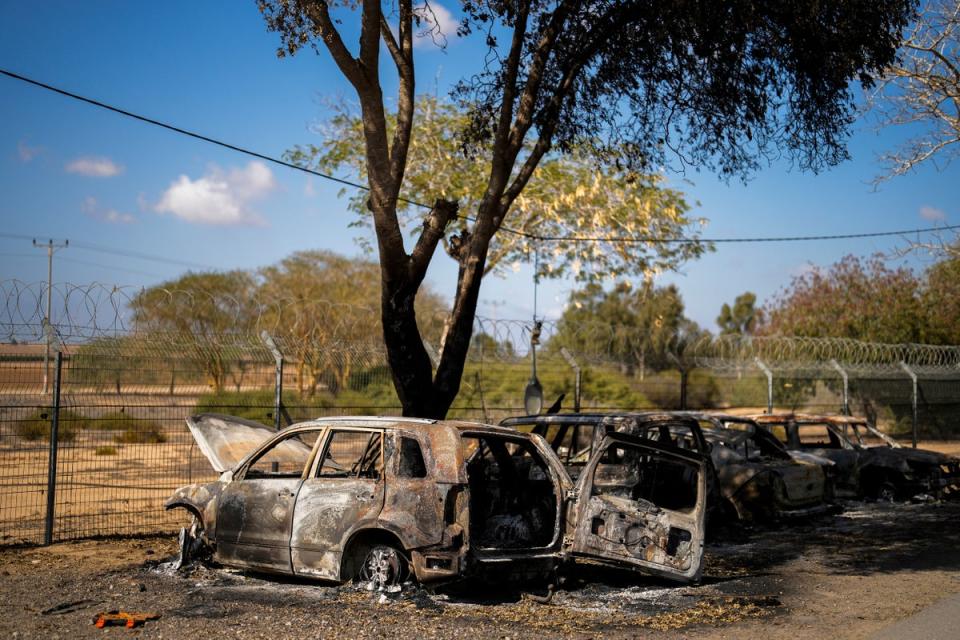 Burned cars next to homes that came under attack during a massive Hamas invasion into Kibbutz Nir Oz (Copyright 2023 The Associated Press. All rights reserved)