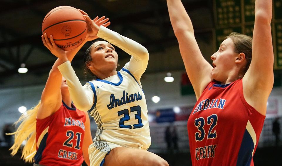 Lake Central's guard Vanessa Wimberly (23) attempts to score against Indian Creek's forward Lexi Sichting (32) on Thursday, Oct. 5, 2023, during the Hall of Fame Classic girls basketball tournament at New Castle Fieldhouse in New Castle. Lake Central defeated Indian Creek, 51-45.