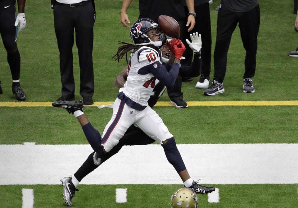 <p>Houston Texans wide receiver DeAndre Hopkins (10) bobbles a pass as Jacksonville Jaguars cornerback A.J. Bouye defends on the play during the first half of an NFL football game Sunday, Sept. 10, 2017, in Houston. (AP Photo/Eric Gay) </p>