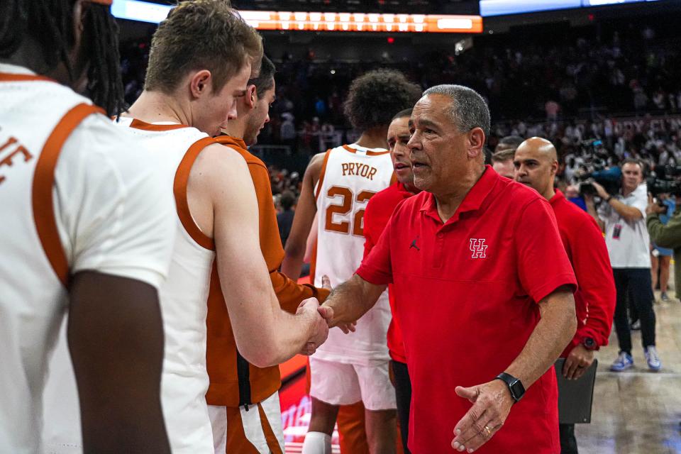 Houston  coach Kelvin Sampson shakes hands with Texas forward Cole Bott after the Cougars' overtime win over the Longhorns on Jan. 29 in Austin. Sampson has leaned heavily on Houston-area recruits while rebuilding the basketball program in his decade at the school.