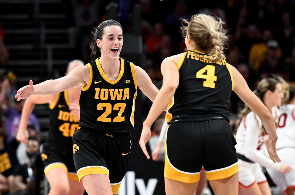 Iowa's Caitlin Clark celebrates with Kylie Feuerbach in the second half against Virginia Tech at Spectrum Center in Charlotte, North Carolina, on Nov. 9, 2023. (Photo by G Fiume/Getty Images)