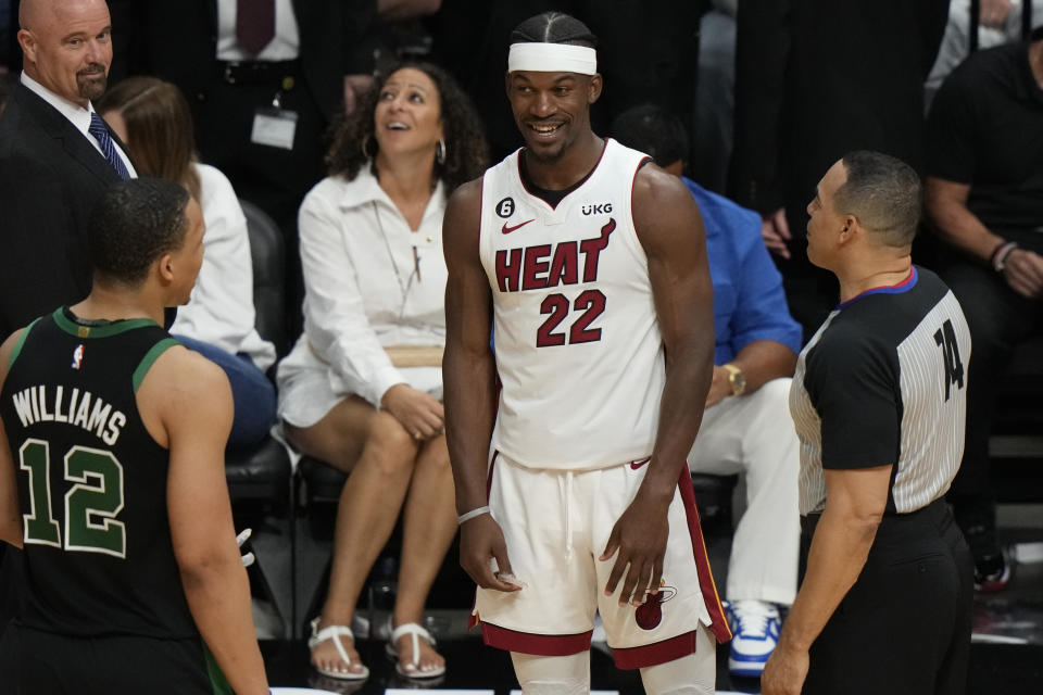 Miami Heat forward Jimmy Butler (22) talks to Boston Celtics forward Grant Williams (12) during the second half of Game 3 of the Eastern Conference finals. (AP Photo/Lynne Sladky)