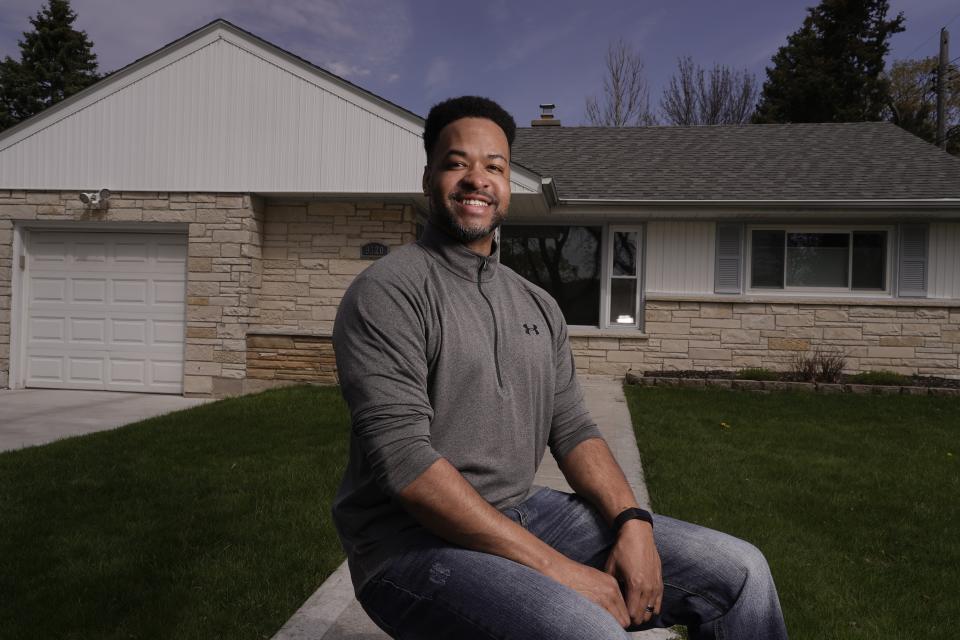 Chris Alexander poses for a picture outside his Wauwatosa, Wis., home April 23, 2021. (AP Photo/Morry Gash)