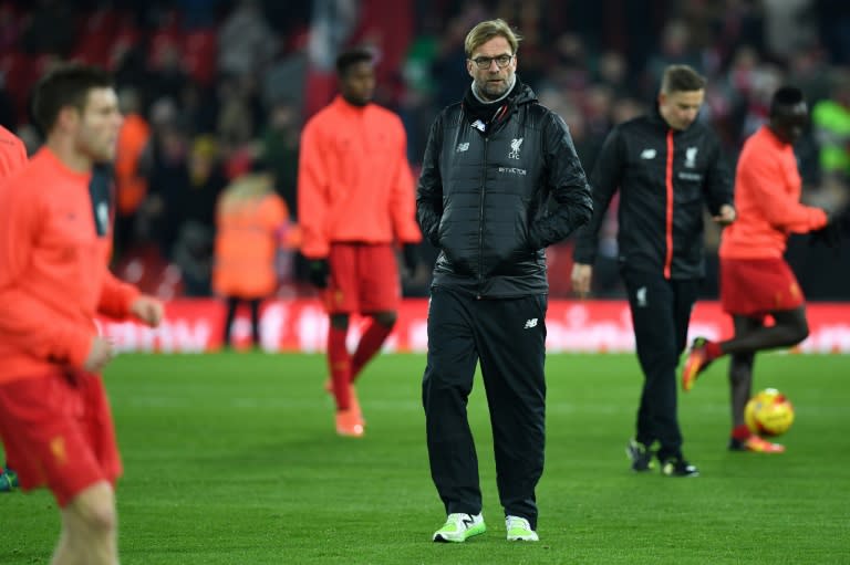 Liverpool's German manager Jurgen Klopp watches his players warm up at Anfield in Liverpool, north west England