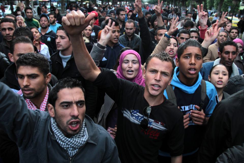 People demonstrate in Tunis , to protest police violence in Tunisian town of Siliana Thursday, Nov. 29, 2012. Tunisia's army intervened Thursday in a third day of violent clashes in a northern town between police and striking residents who are demanding jobs and investment. After two days of battles that a hospital said left more than 300 people injured, police pulled out of Siliana Wednesday night. Witnesses said 15,000 people marched through the town Thursday demanding the governor's resignation. (AP Photo/Amine Landoulsi)