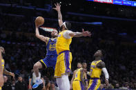 Golden State Warriors guard Stephen Curry (30) shoots as Los Angeles Lakers forward Anthony Davis (3) defends during the first half in Game 4 of an NBA basketball Western Conference semifinal Monday, May 8, 2023, in Los Angeles. (AP Photo/Marcio Jose Sanchez)