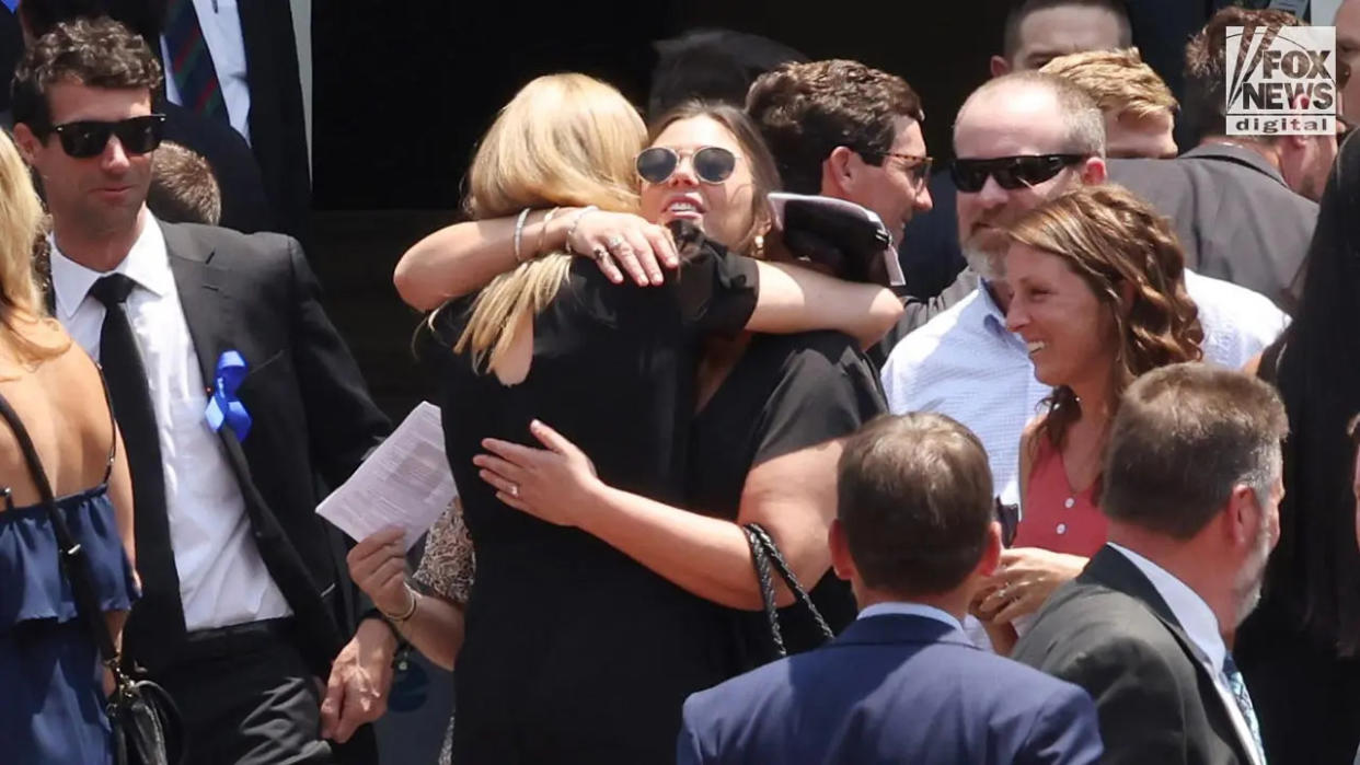 People attend a funeral a church for Johnny Wactor