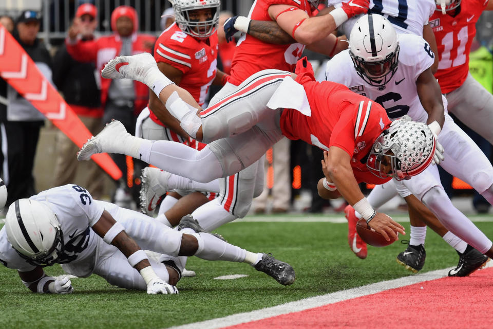 Ohio State QB Justin Fields fumbles the ball at the goal line after being upended by Penn State's Lamont Wade. (Jamie Sabau/Getty Images)