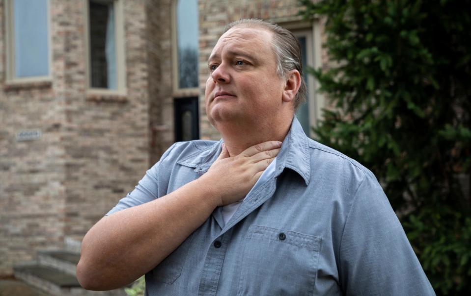 David Markiewicz, 45, of Shelby Township, stands in front of his home on Saturday, Nov. 12, 2022. Markiewicz and his ex-wife are fighting over custody of a frozen embryo, Markiewicz wants to dispose of it, and his ex-wife wants to carry it and have another baby. According to Markiewicz, one of his reasons for wanting to dispose of the embryo is not getting to be a part of that baby's life. 