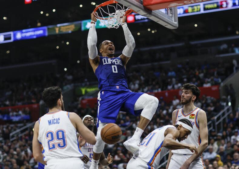 Los Angeles, CA, Tuesday, January 16, 2024 - LA Clippers guard Russell Westbrook (0) slam dunks over three Oklahoma City Thunder players during second half action at Crypto.com Arena. (Robert Gauthier/Los Angeles Times)