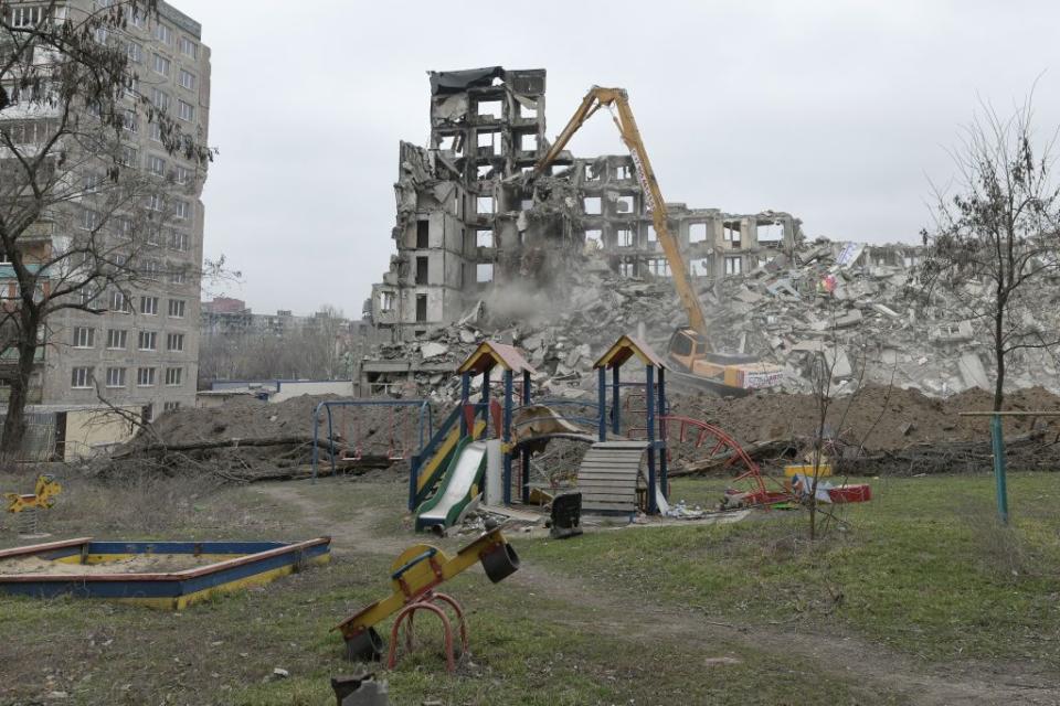 Damaged buildings are being demolished in Russian-occupied Mariupol, Ukraine, on March 16, 2023. (Photo by Stringer/Anadolu Agency via Getty Images)