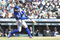 Kansas City Royals' Bobby Witt Jr. hits a sacrifice fly, scoring Adam Frazier, against the Detroit Tigers in the third inning of a baseball game, Friday, April. 26, 2024, in Detroit. (AP Photo/Jose Juarez)