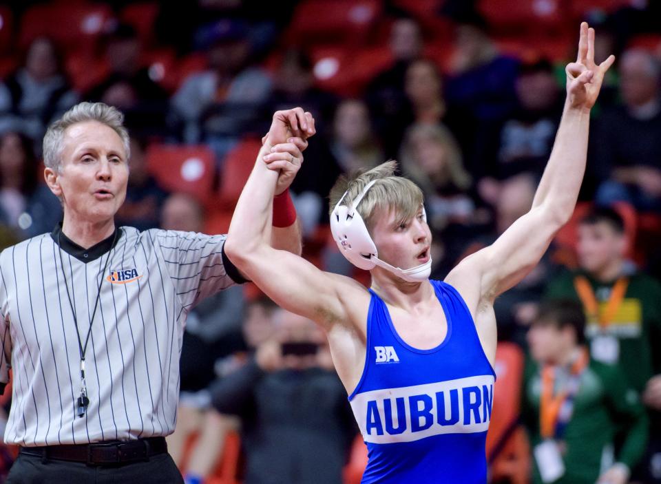Auburn's Joey Ruzic celebrates his 6-1 decision over Coal City's Brody Widlowski in the 126-pound match of the Class 1A state wrestling championships Saturday, Feb. 17, 2024 at the State Farm Center in Champaign. This was the senior's third straight title.