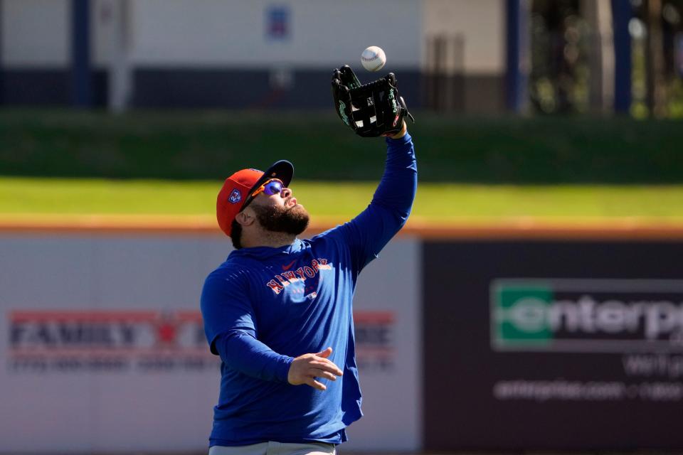 New York Mets' DJ Stewart catches a ball during a spring training baseball workout Tuesday, Feb. 20, 2024, in Port St. Lucie, Fla.