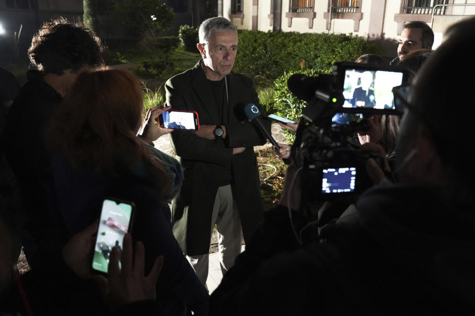 Greek left-wing member of the European Parliament Stelios Kouloglou makes statements outside a court in Mytilene, on the northeastern Aegean island of Lesbos, Greece, Monday, Jan. 9, 2023. A Somali migrant serving life in prison for people smuggling appeared in court Monday to appeal his sentence, in a case backed by a group of European Parliament members who say he was wrongfully convicted. (AP Photo/Panagiotis Balaskas)