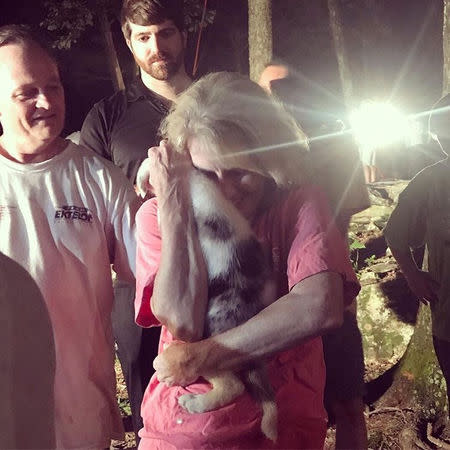 Puppy is being lifted out of a hole and reunited with its fosterer in Huntsville, Alabama, U.S., June 30, 2018 in this picture grab obtained from social media video. Instagram/Katie Ziegler/via REUTERS