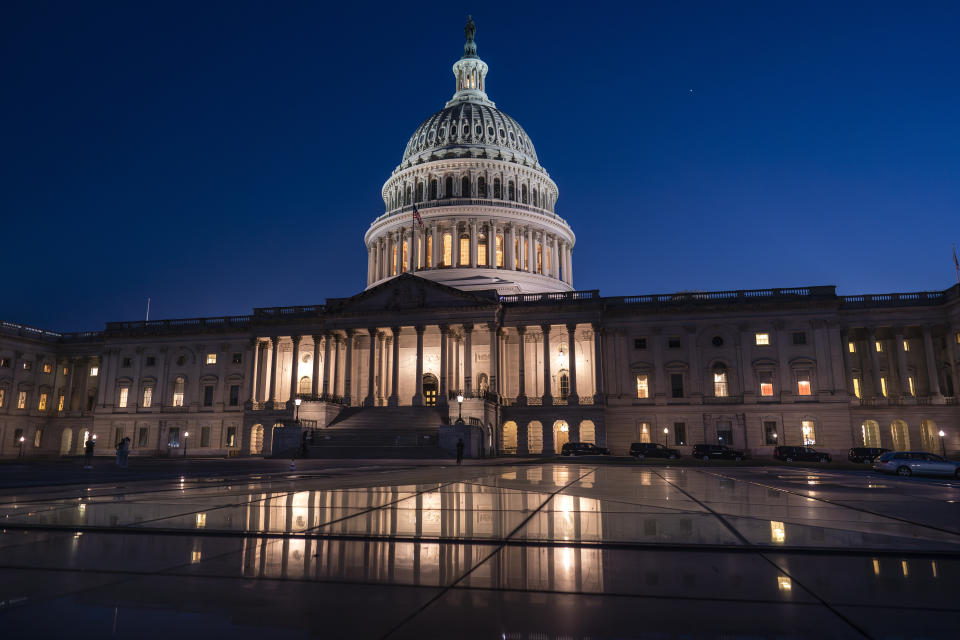 Days away from a default crisis, the Capitol is illuminated as the Senate works into the night to finish votes on amendments on the big debt ceiling and budget cuts package, at the Capitol in Washington, Thursday evening, June 1, 2023. (AP Photo/J. Scott Applewhite)