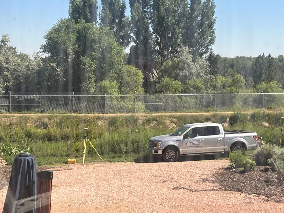 A chain-link fence with rows of barbed wire has gone up next to the Larimer-Weld Canal behind the home of Phil and Pam Soreide in north Fort Collins, viewed from their sunroom.