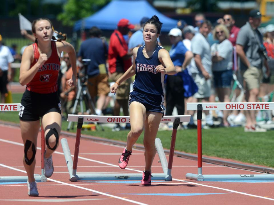 Odessa Smith, of Morgan, runs the finals of the 300 hurdles during the Division II state track and field meet on Saturday at Jesse Owens Memorial Stadium. 