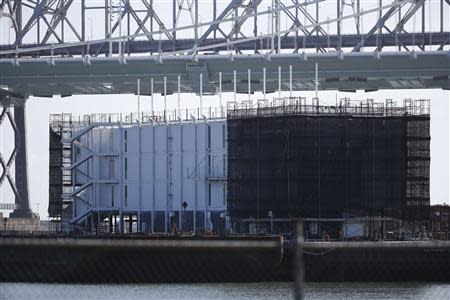 A barge built with four levels of shipping containers is seen at Pier 1 at Treasure Island in San Francisco, California October 28, 2013. How badly does Google want to keep under wraps a mysterious project taking shape on a barge in San Francisco Bay? Badly enough to require U.S. government officials to sign confidentiality agreements. REUTERS/Stephen Lam