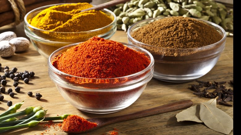 Glass bowls of powdered spices