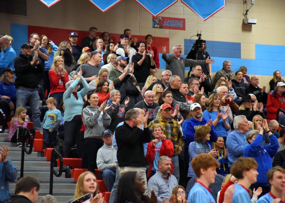 Sioux Falls Lincoln fans celebrate in the final seconds of the game against Brandon Valley on Saturday, March 5, in Sioux Falls.