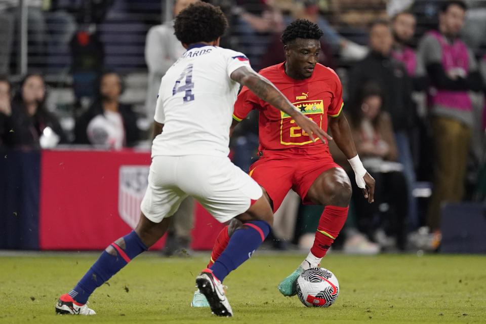 Ghana midfielder Mohammed Kudus, right, tries to move the ball past United States defender Chris Richards (4) during the first half of an international friendly soccer match Tuesday, Oct. 17, 2023, in Nashville, Tenn. (AP Photo/George Walker IV)