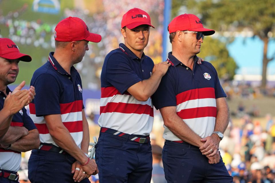 Oct 1, 2023; Rome, ITA; Team USA golfers Jordan Spieth and Justin Thomas reacts with captain Zach Johnson after Team Europe beat Team USA during the final day of the 44th Ryder Cup golf competition at Marco Simone Golf and Country Club. Mandatory Credit: Kyle Terada-USA TODAY Sports