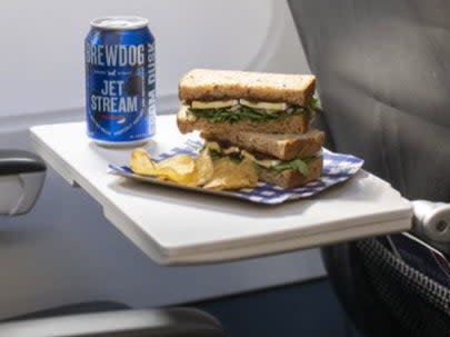 Flight bite: Tom Kerridge’s Brie and chutney sandwich, together with a specially brewed can of beer (British Airways)