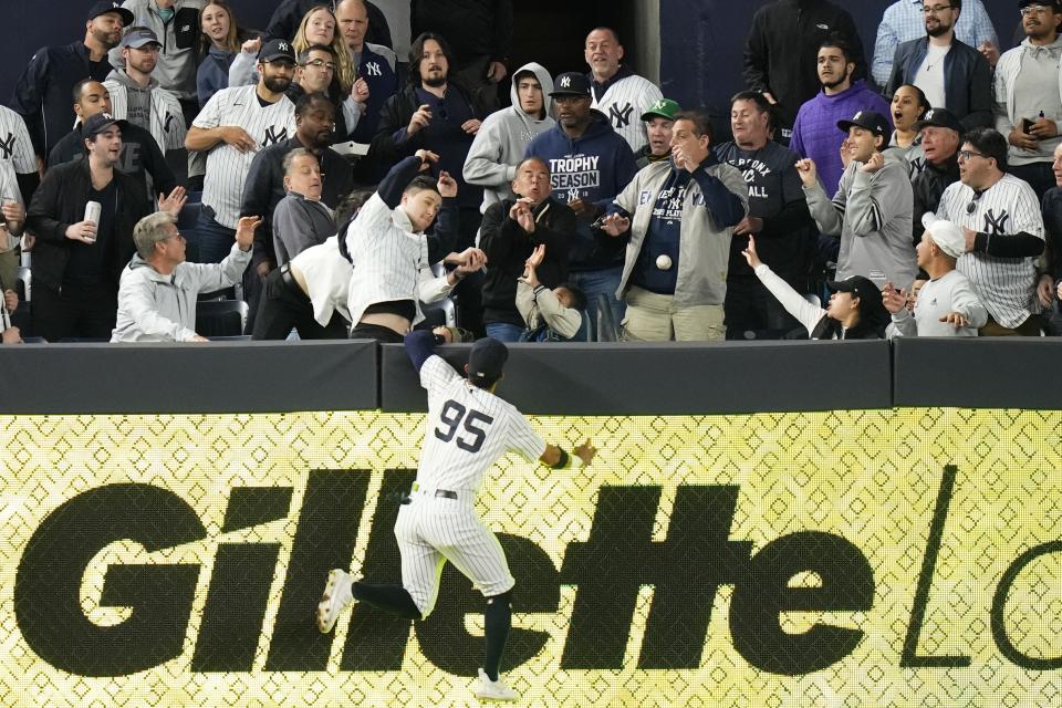 New York Yankees left fielder Oswaldo Cabrera leaps for a ball hit by Oakland Athletics' Jordan Diaz for a home run during the seventh inning of a baseball game Tuesday, May 9, 2023, in New York. (AP Photo/Frank Franklin II)