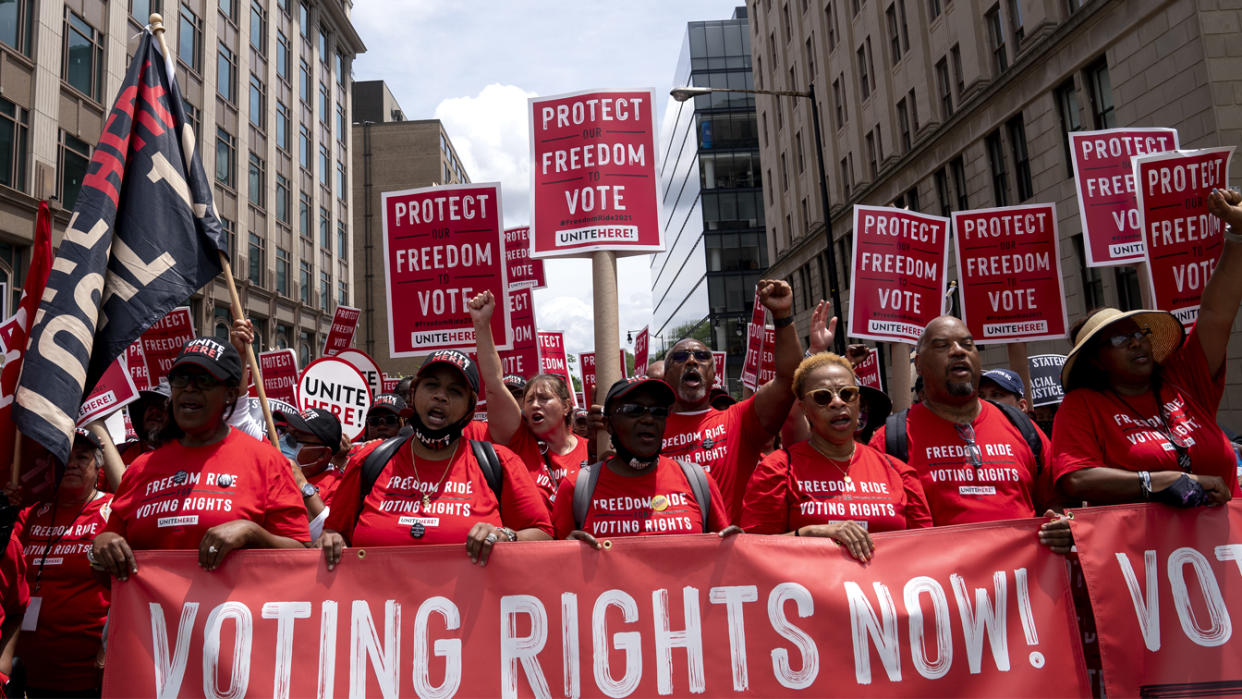 Demonstrators march during a Freedom Ride for Voting Rights rally in Washington, D.C., U.S., on Saturday, June 26, 2021. (Stefani Reynolds/Bloomberg via Getty Images)