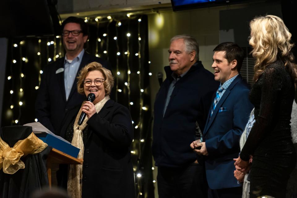 Annette Eustice, Cheboygan County Community Foundation Executive Director, accepts the Organization of the Year award on behalf of the community foundation at the annual Cheboygan Area Chamber of Commerce awards dinner at the Knights of Columbus on Thursday, Jan. 18, 2024.